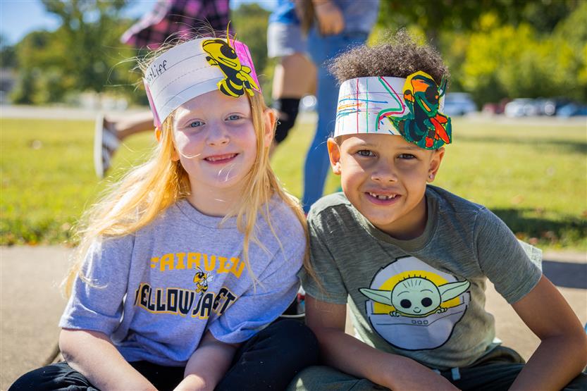 Two students smile during the Fairview homecoming parade
